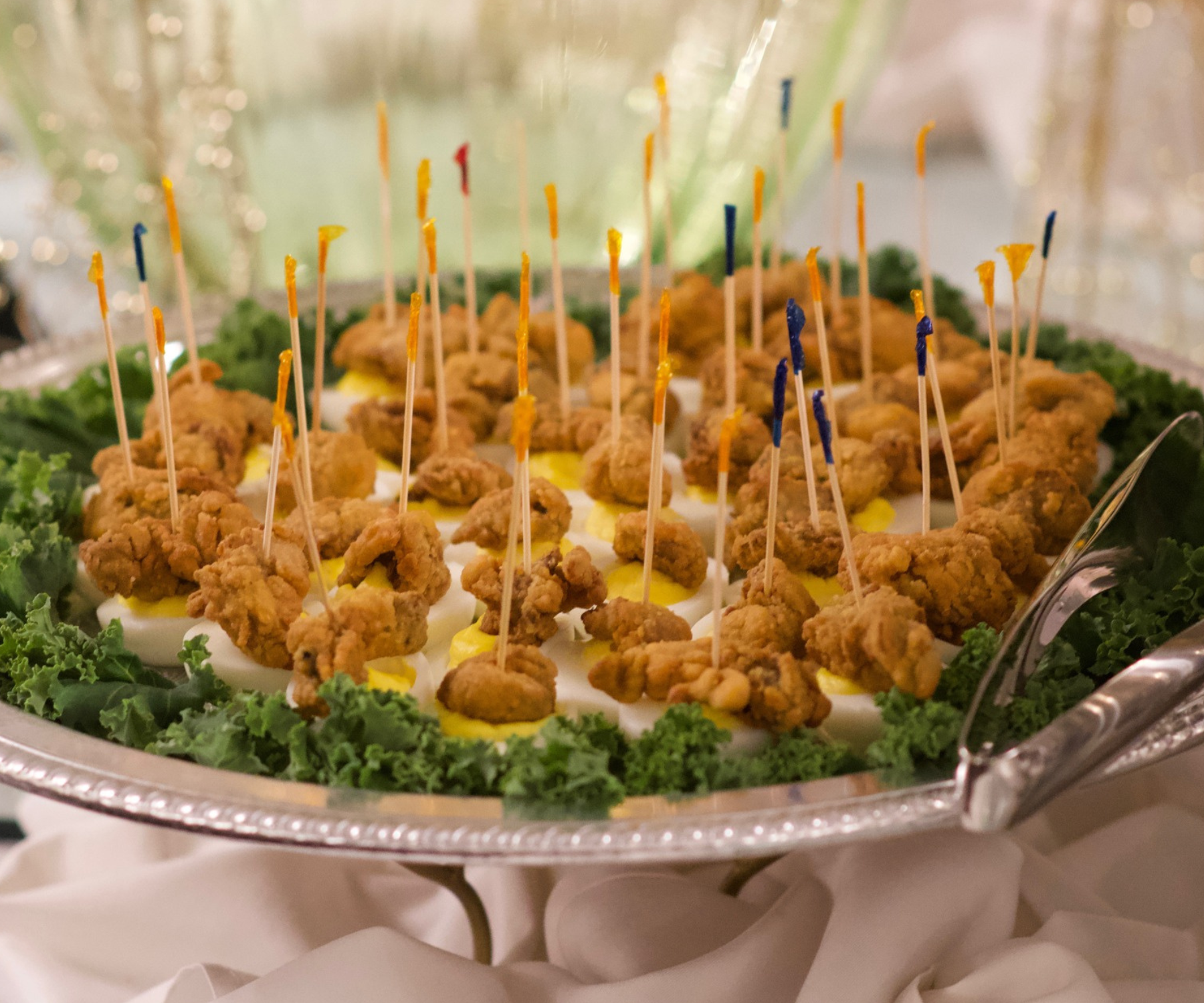 Appetizers platter with popcorn shrimp and deviled eggs on toothpicks at Darlington Country Club's dining area