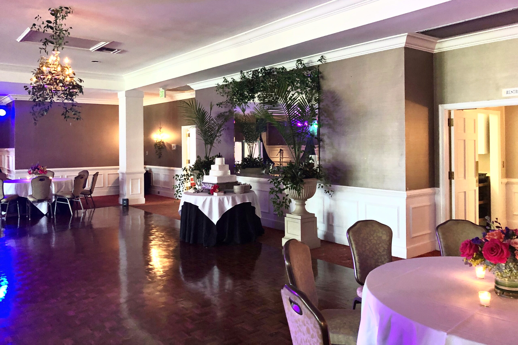 Wedding cake on a table in the wedding ballroom at Darlington Country Club