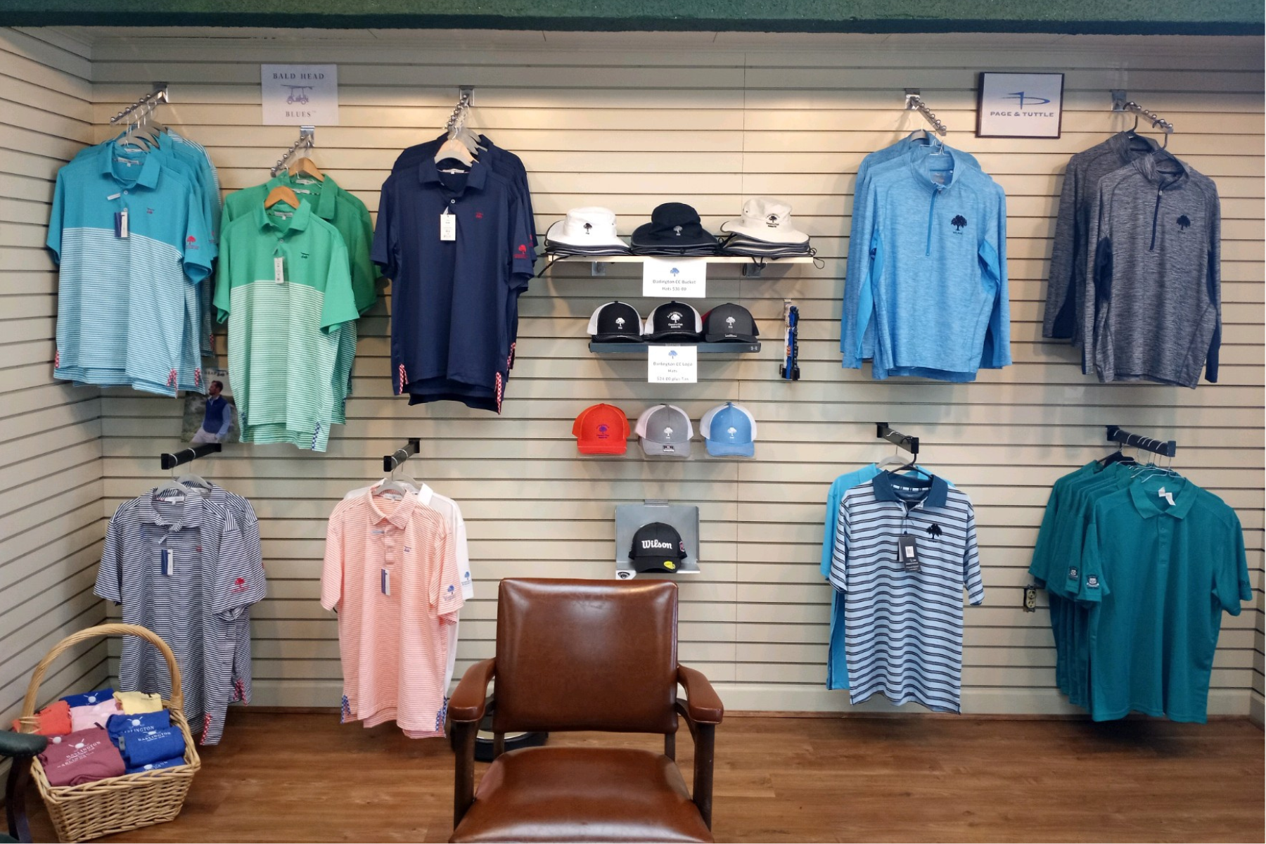 A display of shirts and hats in the Darlington Country Club Pro Shop.