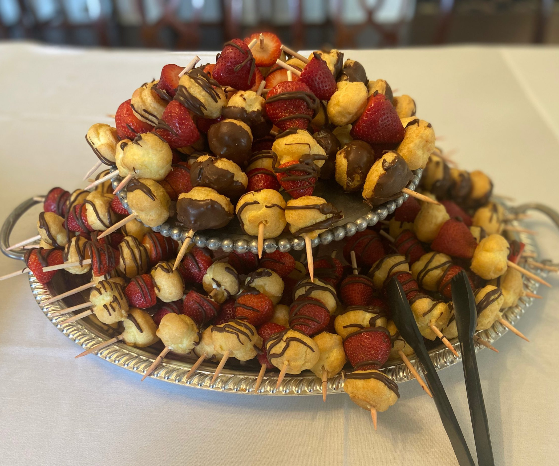 Two-tiered platter of chocolate covered strawberry-cream puff skewers at Darlington Country Club's dining area